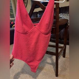 Hot pink body suit